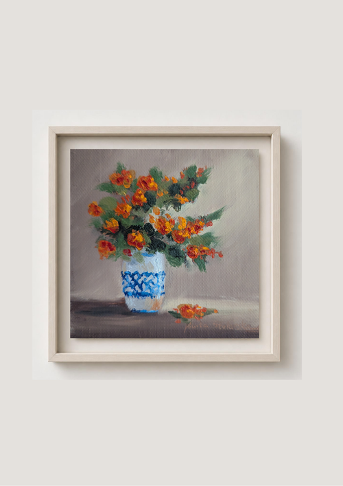 Oil painting of a bouquet of orange flowers in a blue and white vase on a gray background. Original oil painting of an autumnal trio of flowers or fruits, warm amber and rust tones still life