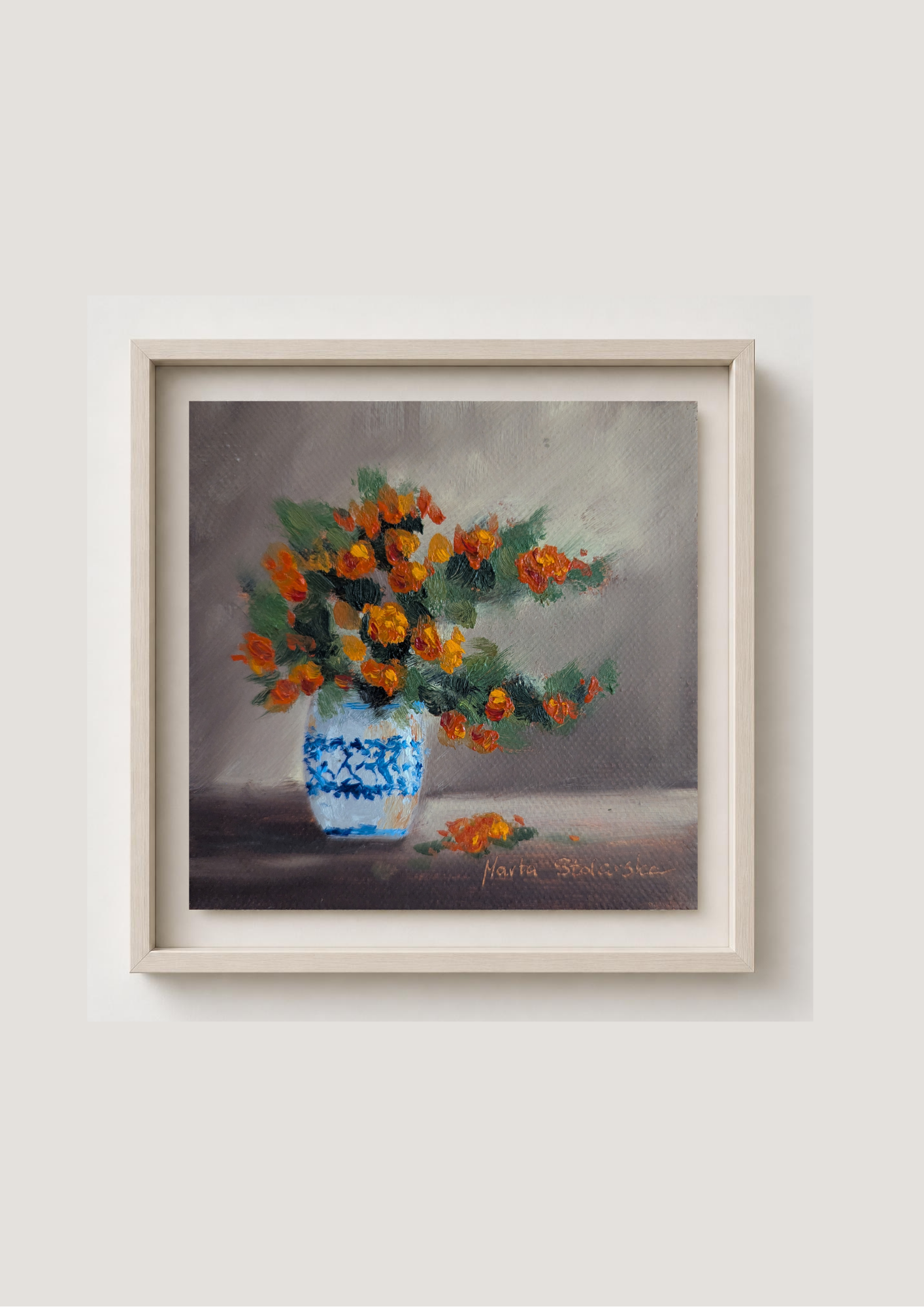 Oil painting of a bouquet of orange flowers in a blue and white vase on a gray background. Original oil painting of an autumnal trio of flowers or fruits, warm amber and rust tones still life