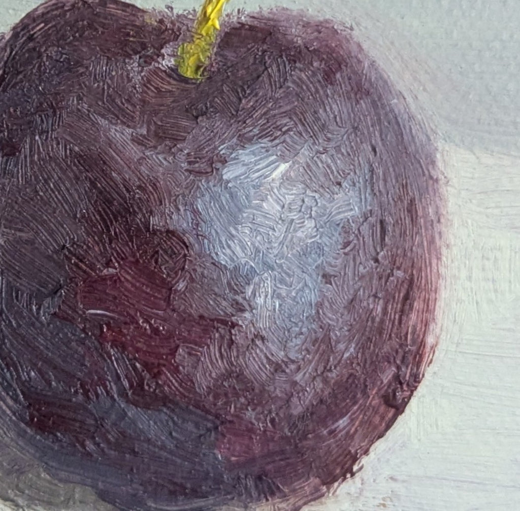 close up on the reflections of a juicy plum