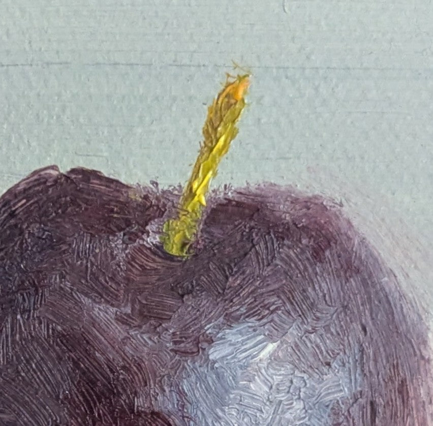 Close of of an oil painting of a juicy plum