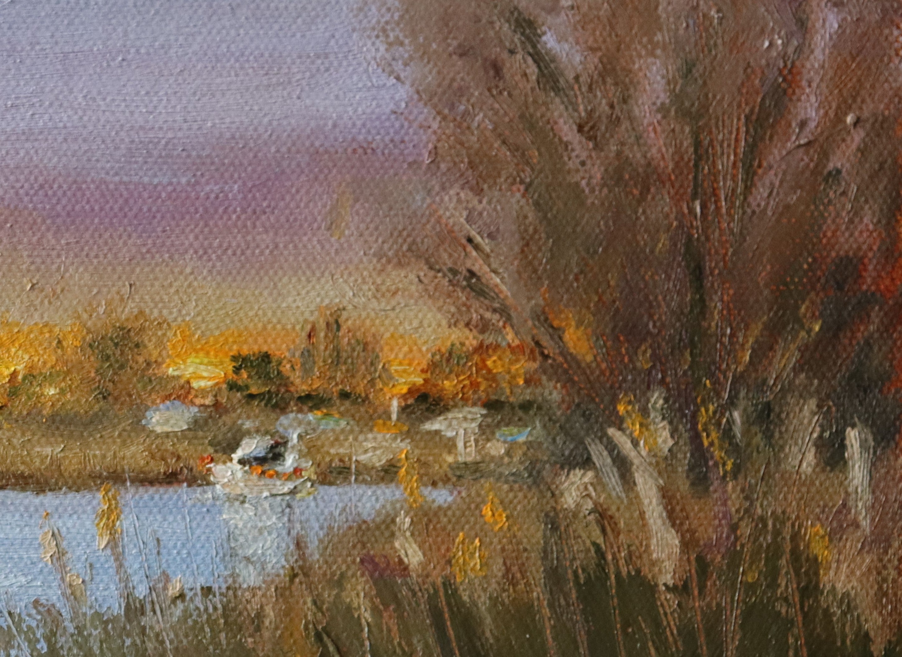 Painting of a landscape with a lake, trees, and a boat at sunset. Original oil painting of boaters enjoying sunset at the Suffolk marshes, warm evening light on water by local artist