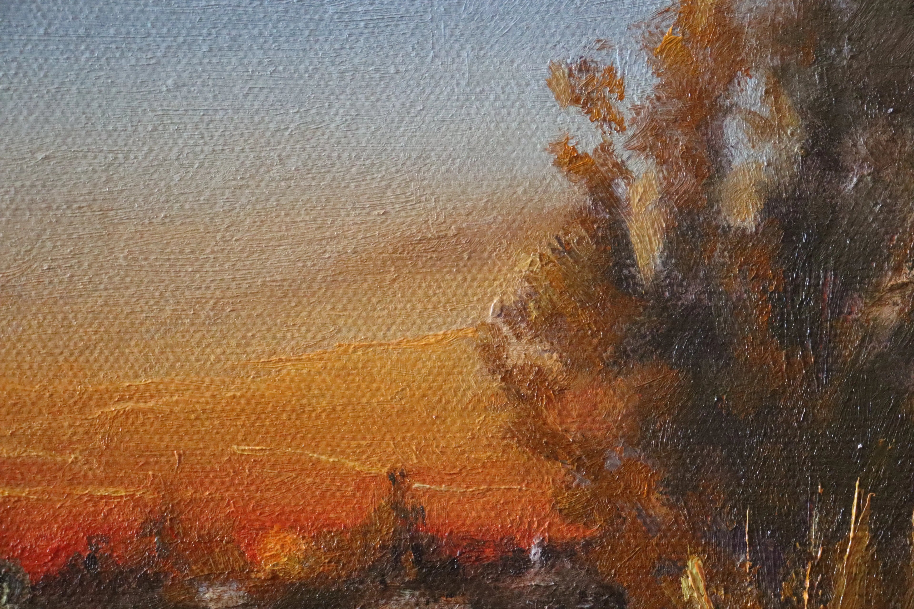 Painting of a landscape with a lake, trees, and a boat at sunset. Original oil painting of boaters enjoying sunset at the Suffolk marshes, warm evening light on water by local artist
