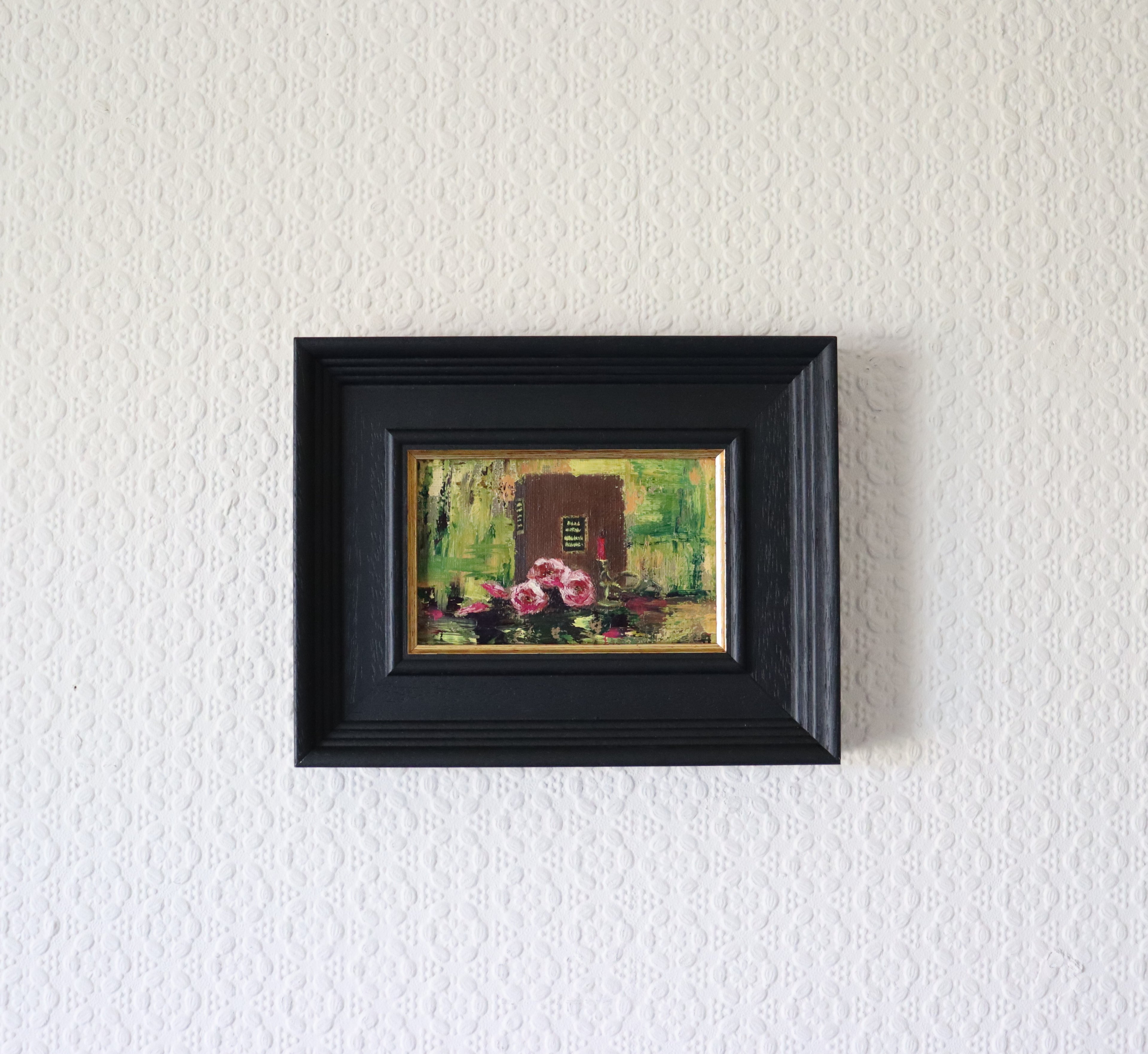 Framed Still life painting with pink flowers and a candle on a reflective surface. Original painting The Book of Spells, mysterious atmospheric artwork by Marta Stolarska Fine Art 
