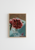 Camellia in an Espresso Cup - original oil painting by Marta Stolarska, a deep pink camellia in a glass espresso cup against a soft teal-blue background, painted en plein air on handmade linen board, 10 x 15 cm