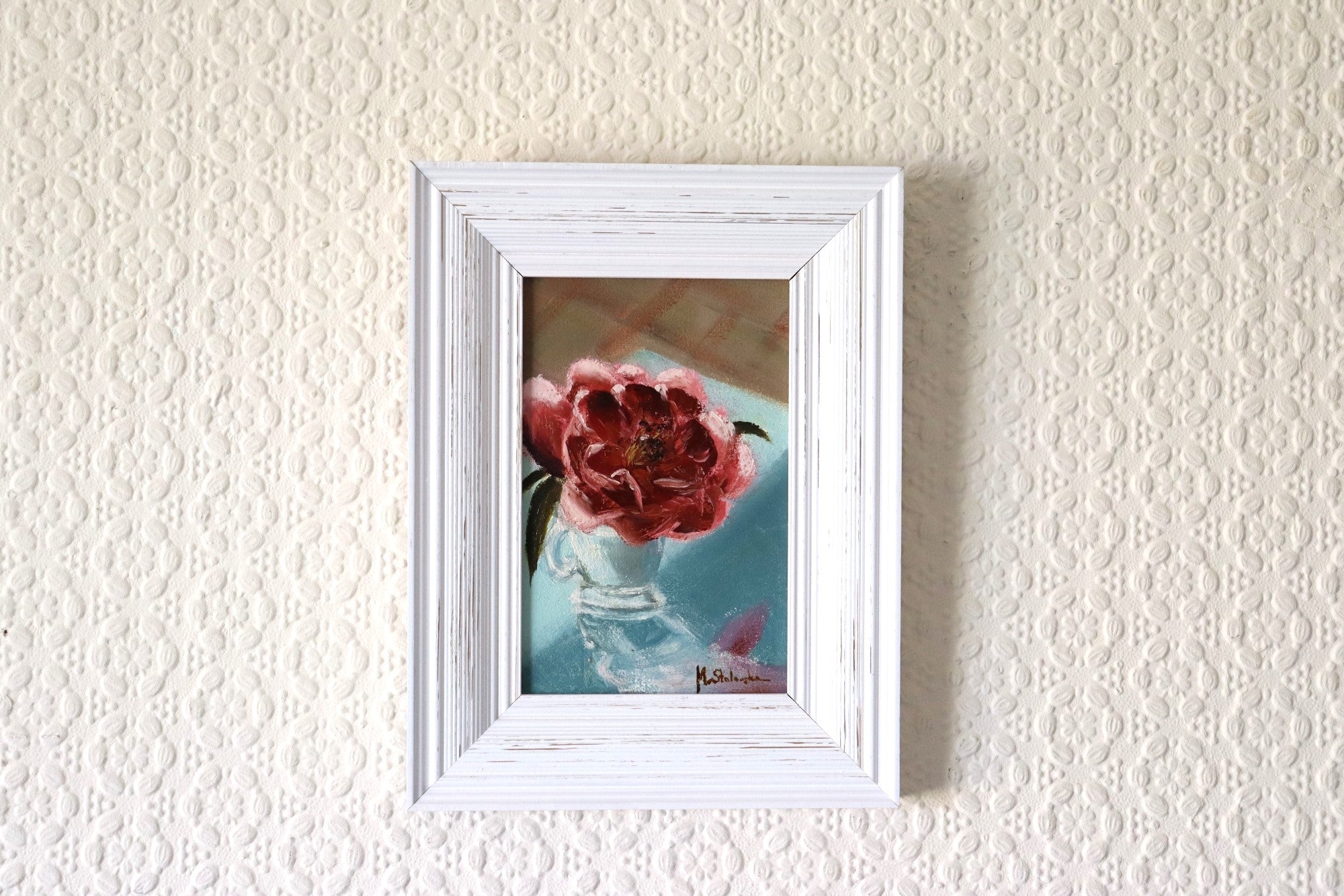 Camellia in an Espresso Cup original oil painting hung on a wall - pink camellia in glass cup in modern white wooden frame, approx. 18.5 x 23.5 cm, by Marta Stolarska Fine Art, ready to hang