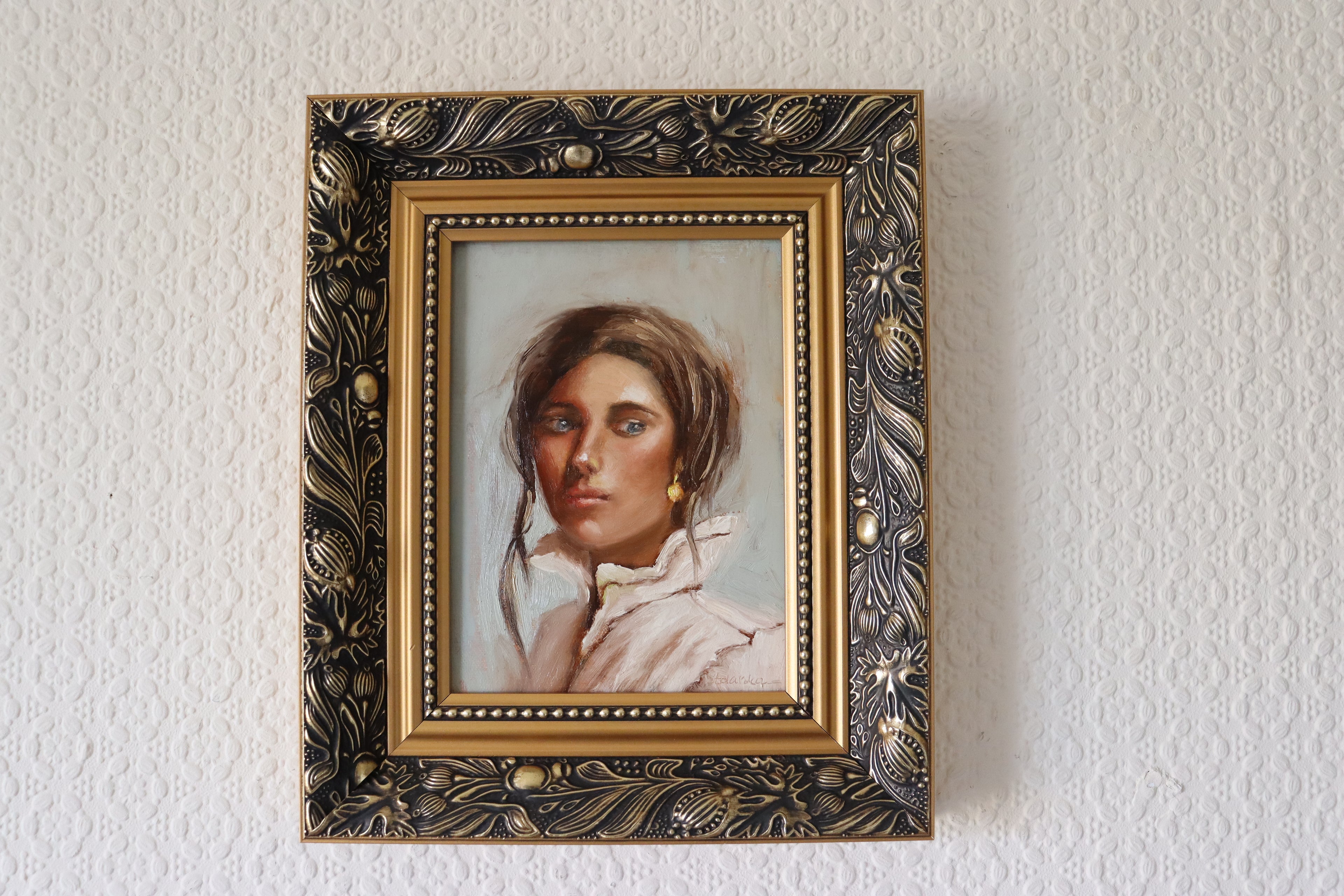 Composed original oil portrait in gold frame - classical head and shoulder study of strong woman with gold earring, 25.5x30.5cm framed by Marta Stolarska Fine Art, ready to hang