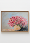 A framed painting of a vibrant pink flower bouquet in a light-colored vase, set against a soft blue-gray background, displayed on a clean white wall. Cotton Candy - original oil painting by Marta Stolarska, mass of small pink flowers with glazed colourful vase on light blue background, in white floating frame, 44.5x54.5cm