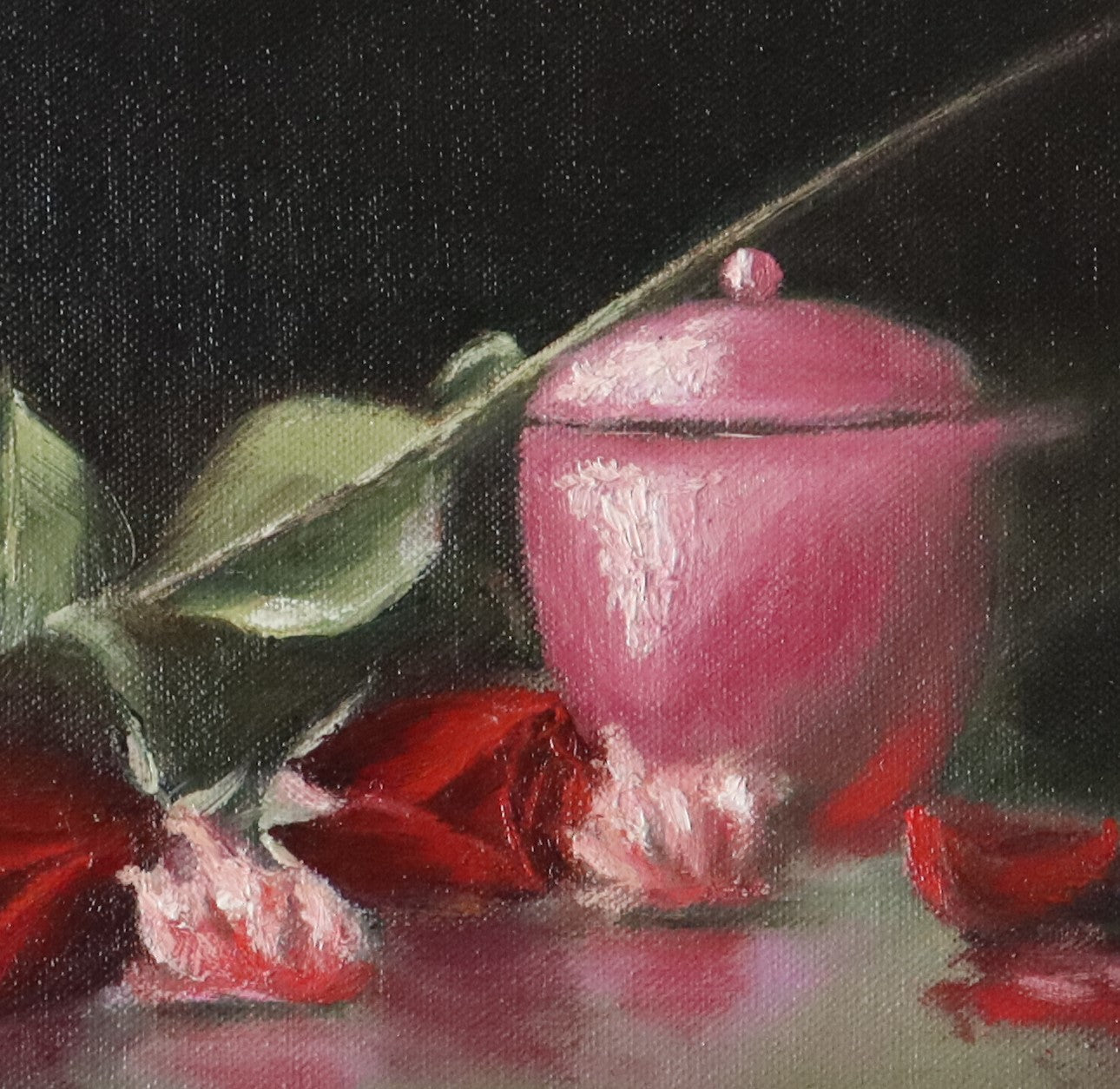 Close-up detail of Darkness and Roses - red rose petals and pink jewellery pot catching light against deep dark background, expressive oil brushwork by Marta Stolarska