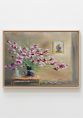 A framed still life painting featuring a bouquet of pink and purple flowers on a table against a beige wall, with a small framed artwork hanging on the wall. Forgotten in Late Summer Heat - original oil painting by Marta Stolarska, an overgrown magenta houseplant in a dark vase on a side table with a clock and unlit candle, imagined composition on handmade linen board, 15 x 10 cm landscape