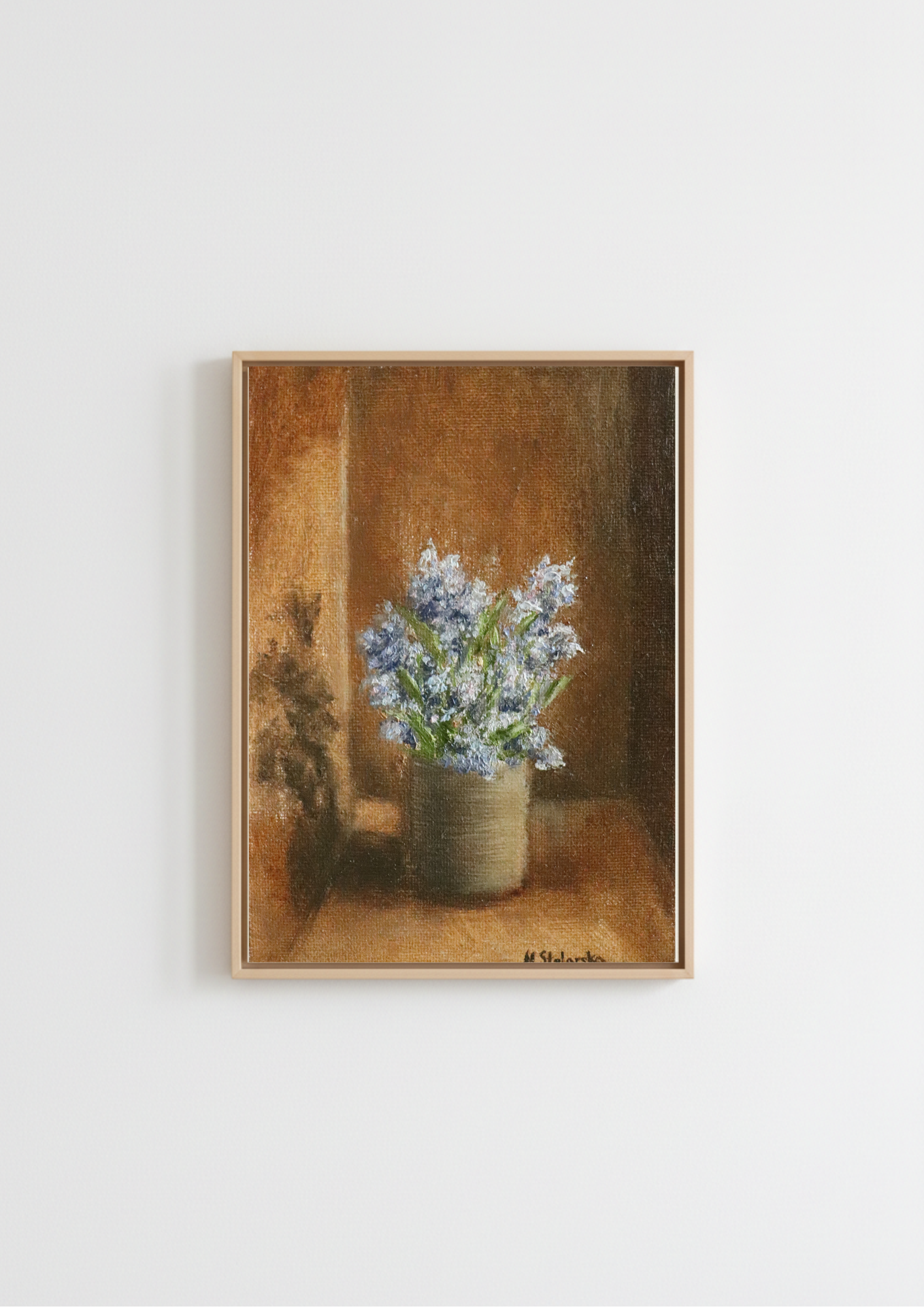 A framed still life painting Fragrant Wildflowers - original oil painting by Marta Stolarska, blue wildflowers in a stoneware pot against a warm golden-brown background, picked on a walk and painted from life on handmade linen board, 10 x 15 cm