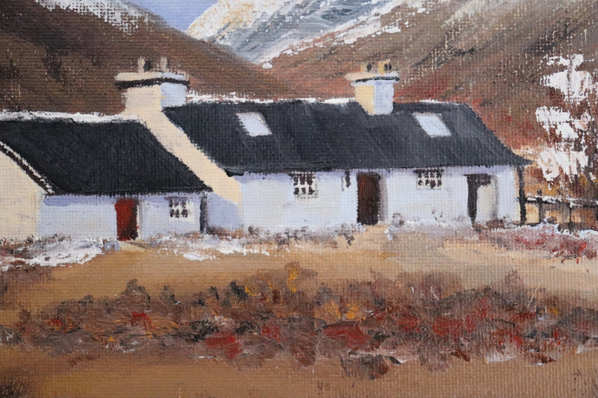 Original oil painting of iconic cottage in Glencoe Scotland in winter, snow-capped mountains, white frame