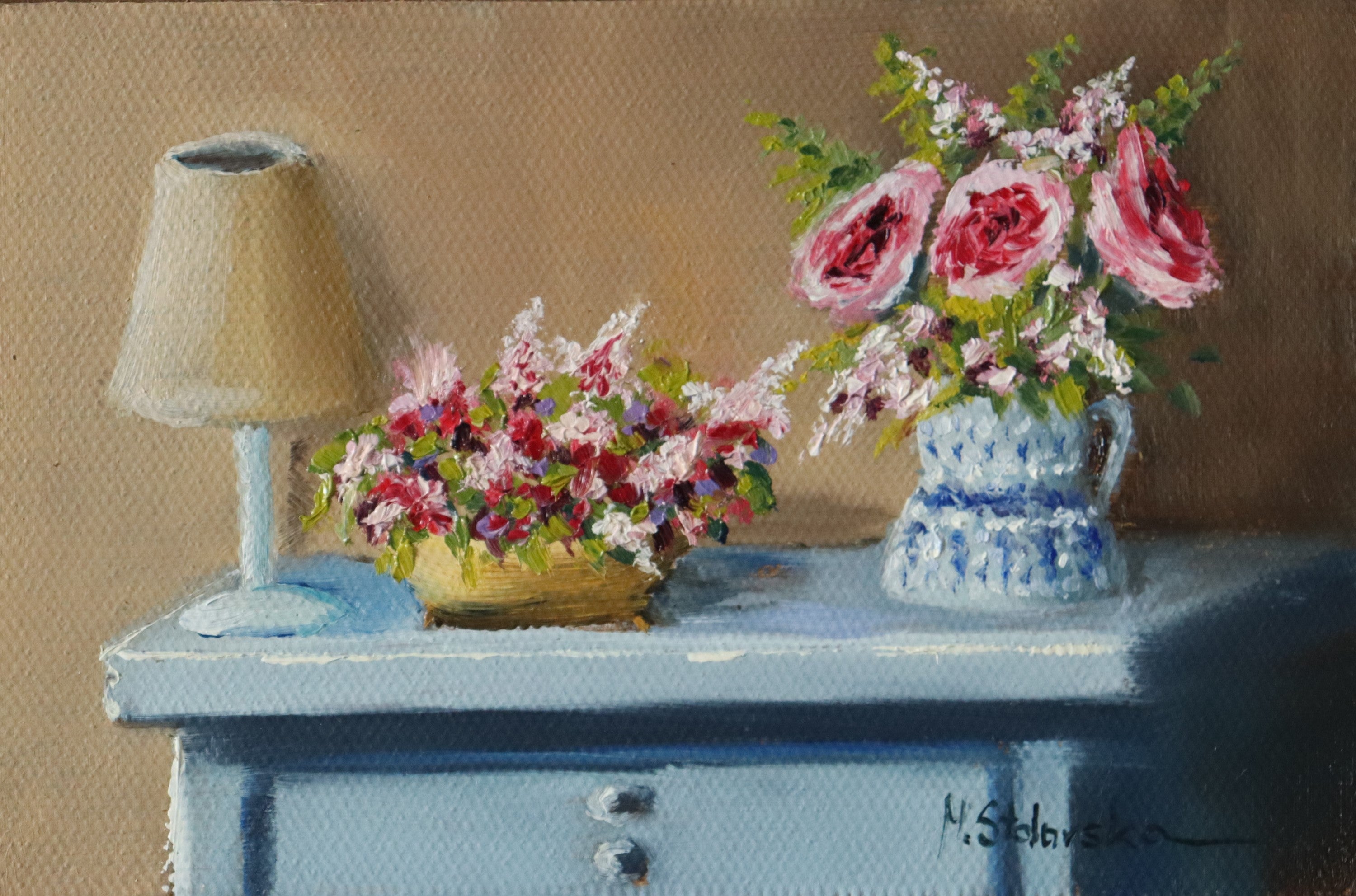 Grandma's Dresser - original oil painting by Marta Stolarska, a pale blue chest of drawers with a small lamp, yellow bowl of pink blossom and blue and white jug of roses, painted on handmade linen board, 10 x 15 cm