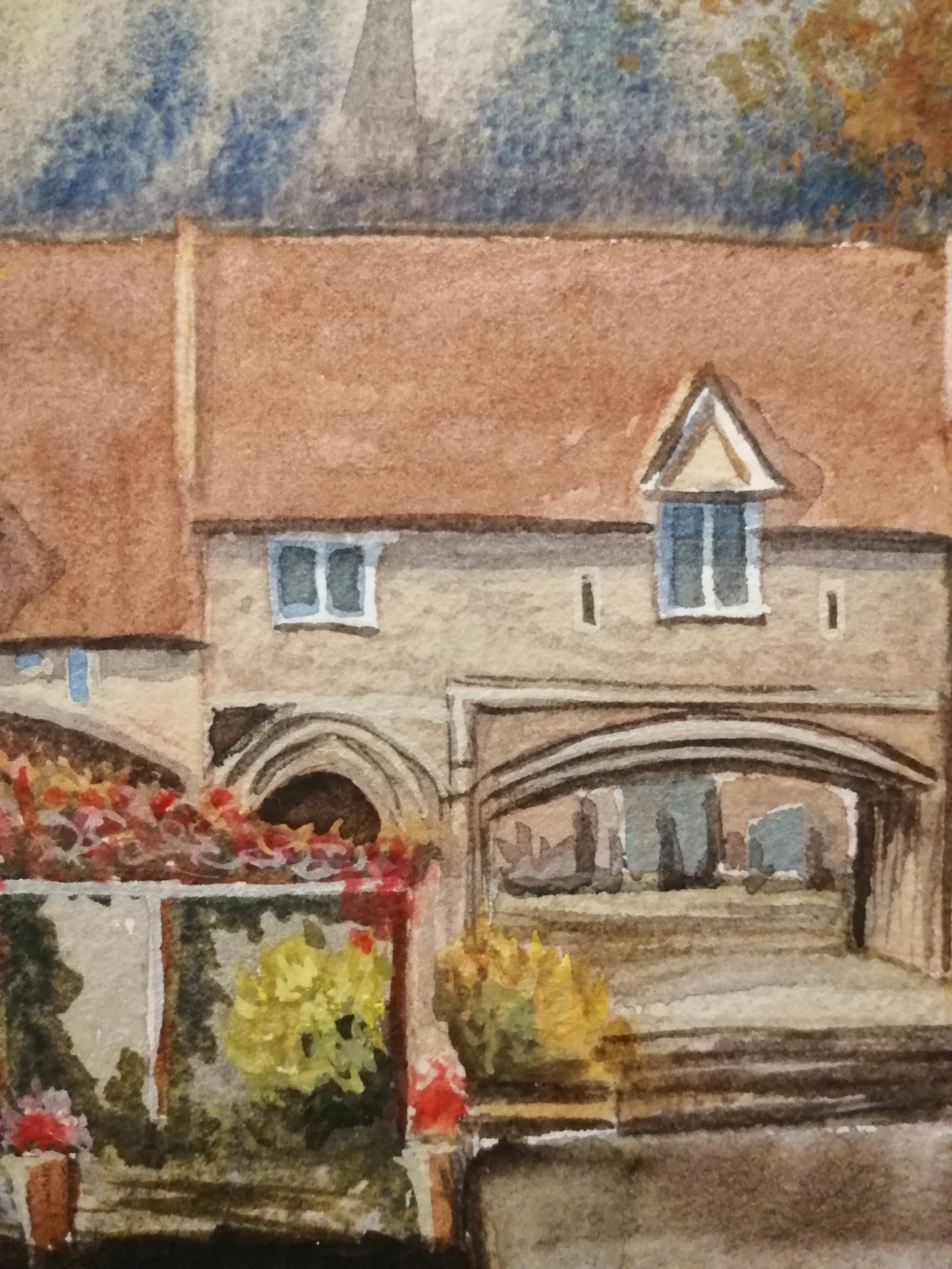 Watercolor painting of a bridge over a river with buildings and flowers in the foreground. Original painting of Pulls Ferry Norwich, historic watergate on the River Wensum