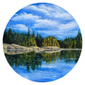 Circular painting of a serene lake surrounded by trees with a blue sky. Original round oil painting of an imagined island landscape inspired by the Lake District, 30cm diameter