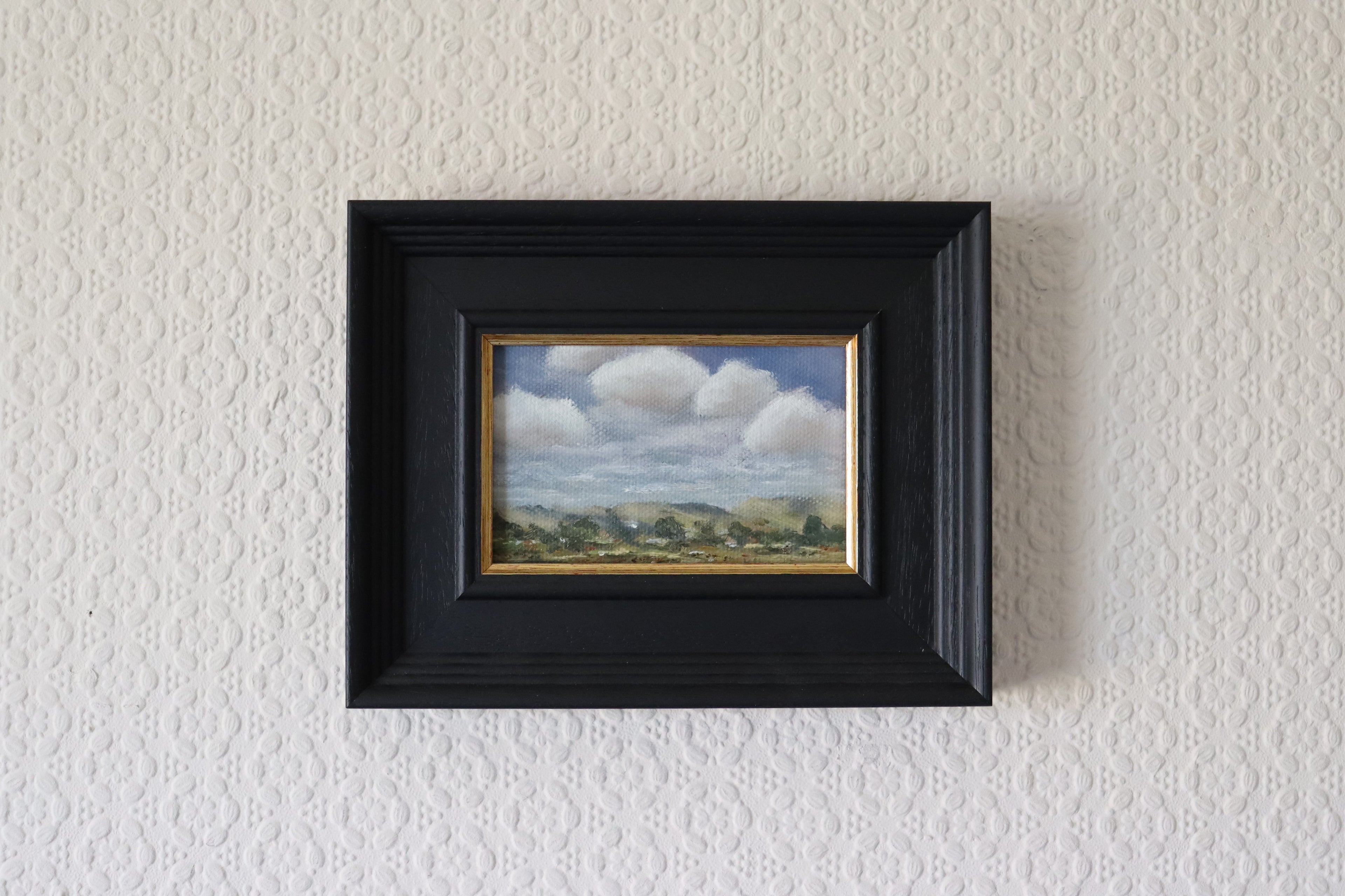Framed Original oil painting of changing weather over open landscape, dramatic sky with clouds and shifting light