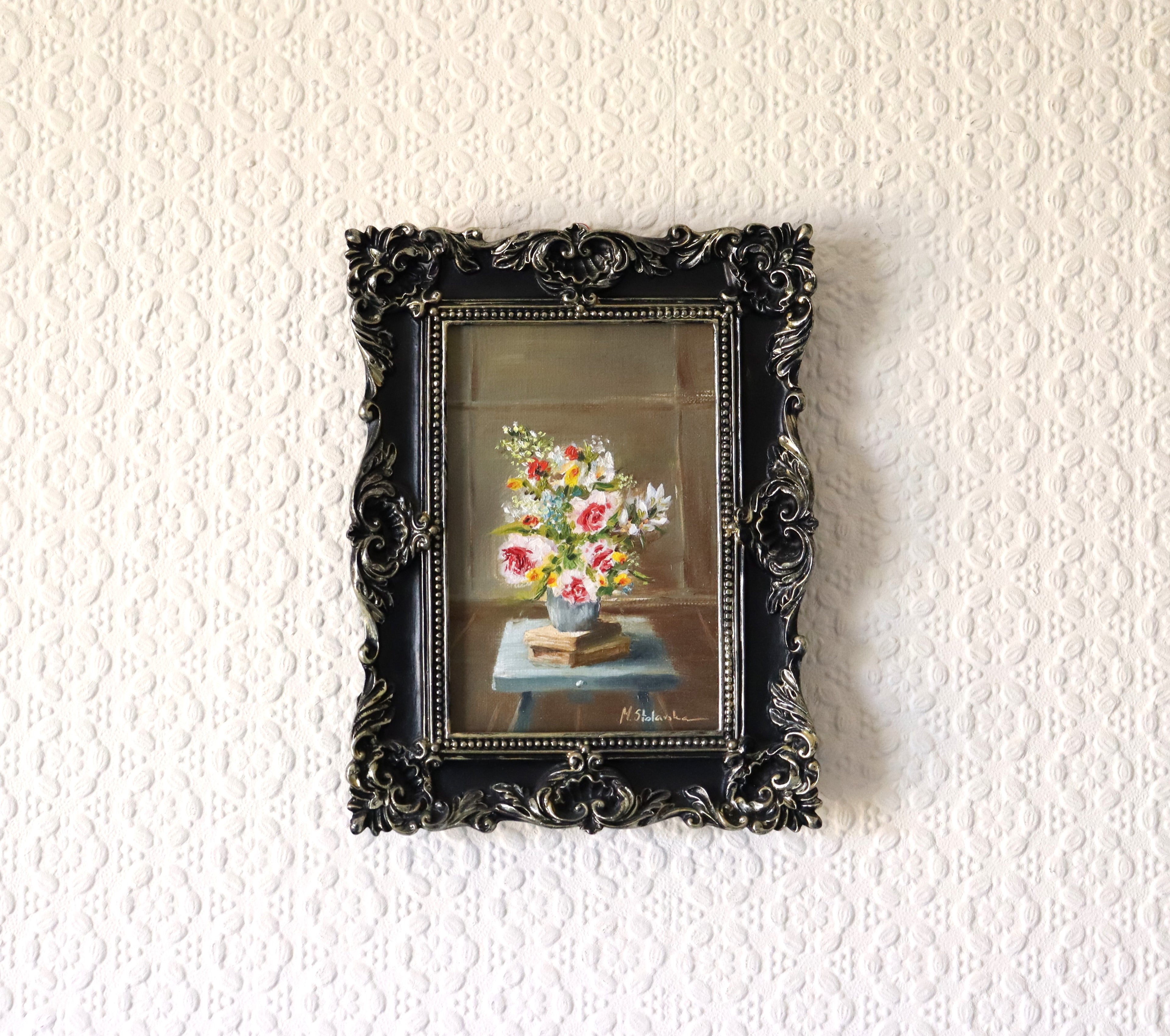 May Abundance original oil painting hung on a wall - abundant spring bouquet in ornate black and silver rococo-style frame, approx. 18.5 x 23.5 cm, by Marta Stolarska Fine Art, can hang or stand