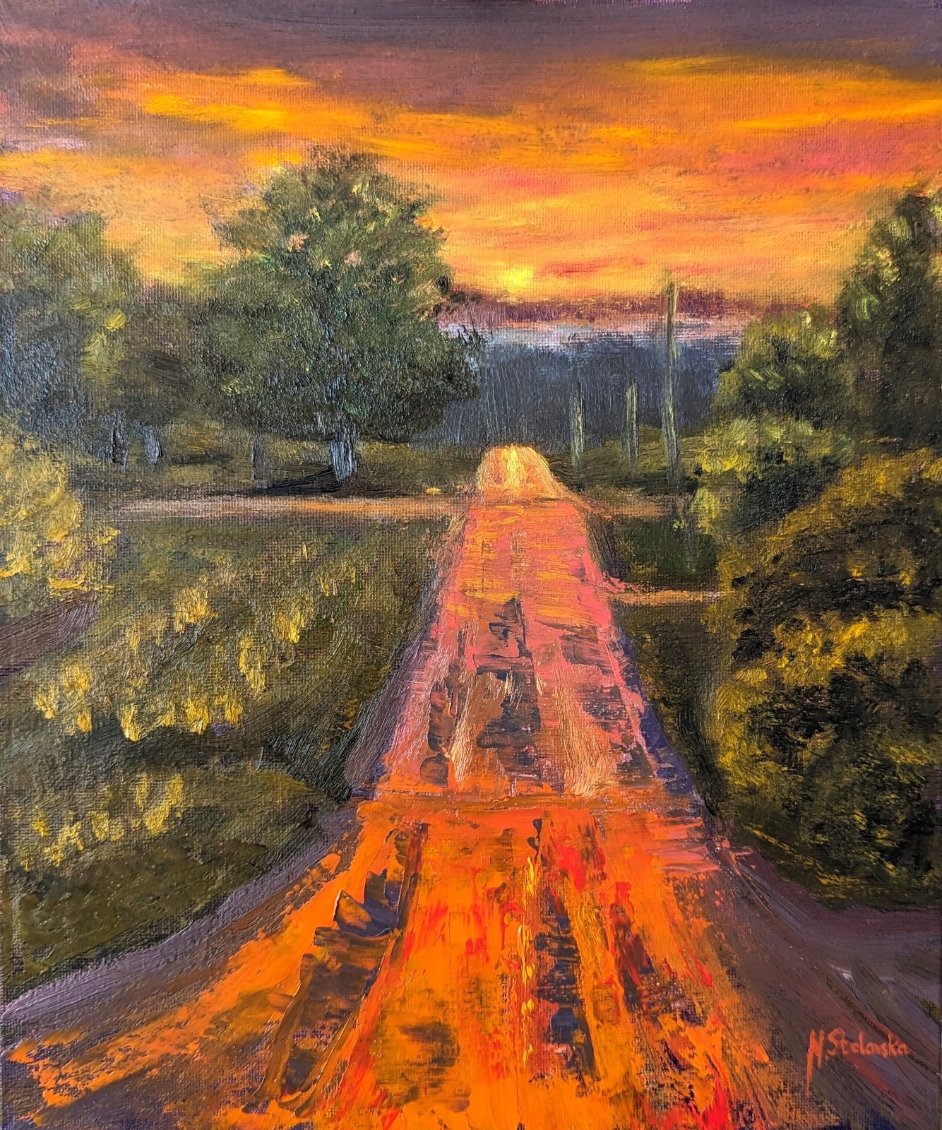 Painting of a road leading to a sunset with trees on either side. Original oil painting of a wet road glowing with reflected sunset colours after rain, imagined landscape, framed
