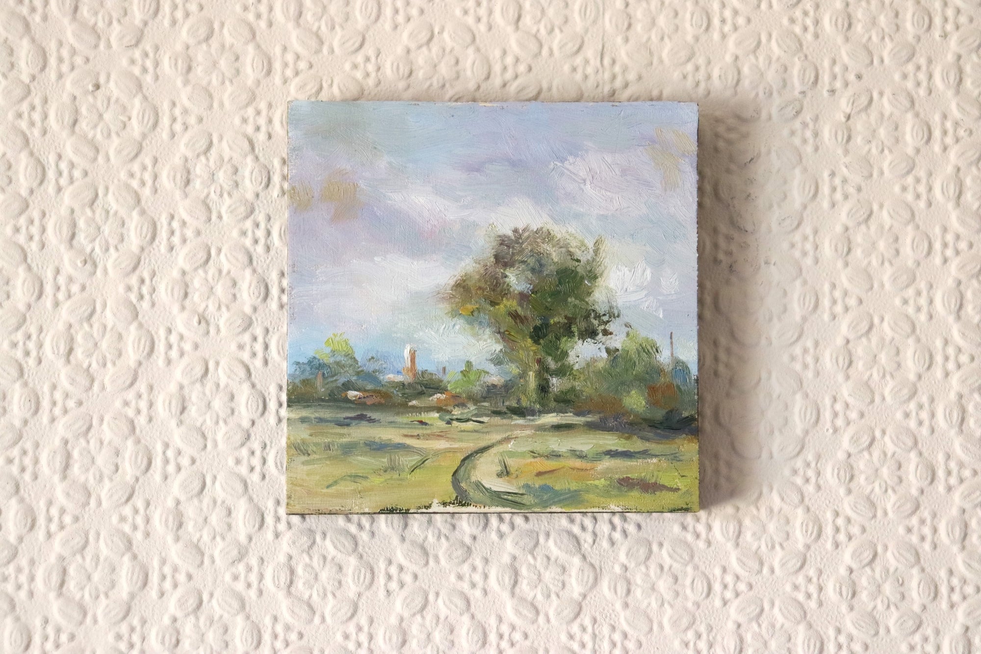 Small Marsh Study - original oil painting of Oulton Marshes, Suffolk, in early spring with a winding path, trees and church tower in warm breezy light. Oil on cradled wooden panel, 4.7 x 4.7 inches, by Marta Stolarska.