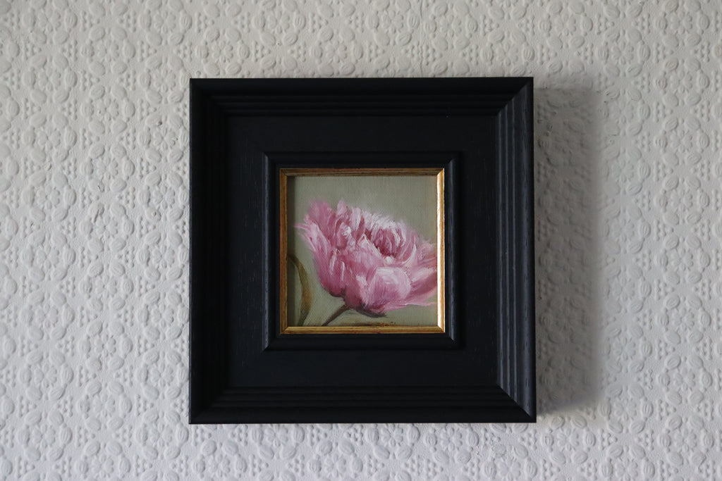 Framed Painting of a pink flower on a green background. Original oil painting of a soft camellia flower, delicate layered petals in quiet elegant still life
