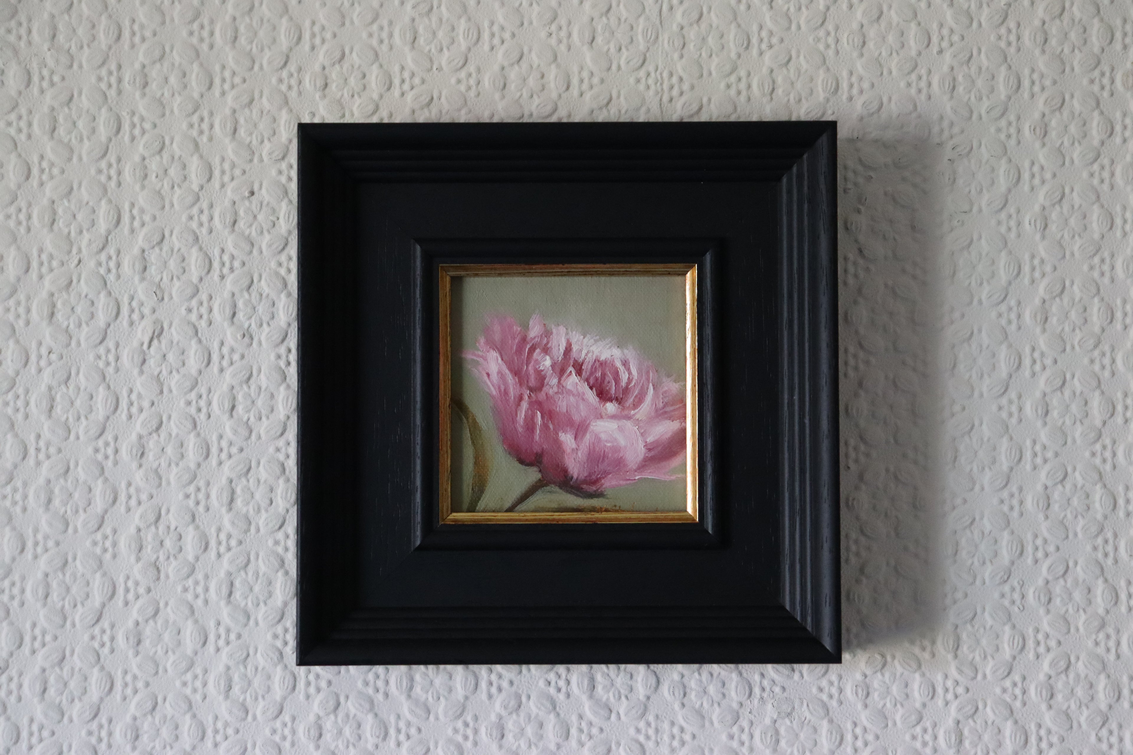 Framed Painting of a pink flower on a green background. Original oil painting of a soft camellia flower, delicate layered petals in quiet elegant still life