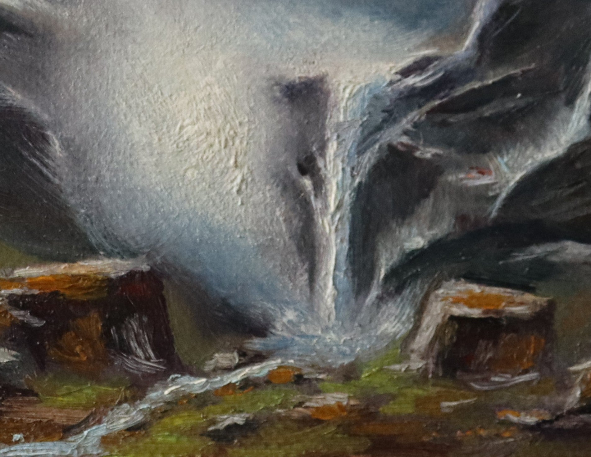 Painting of a mountain landscape with a waterfall and rocky terrain. Original oil painting of an icy waterfall with mist and spray, dramatic winter landscape, black frame with gold bevel
