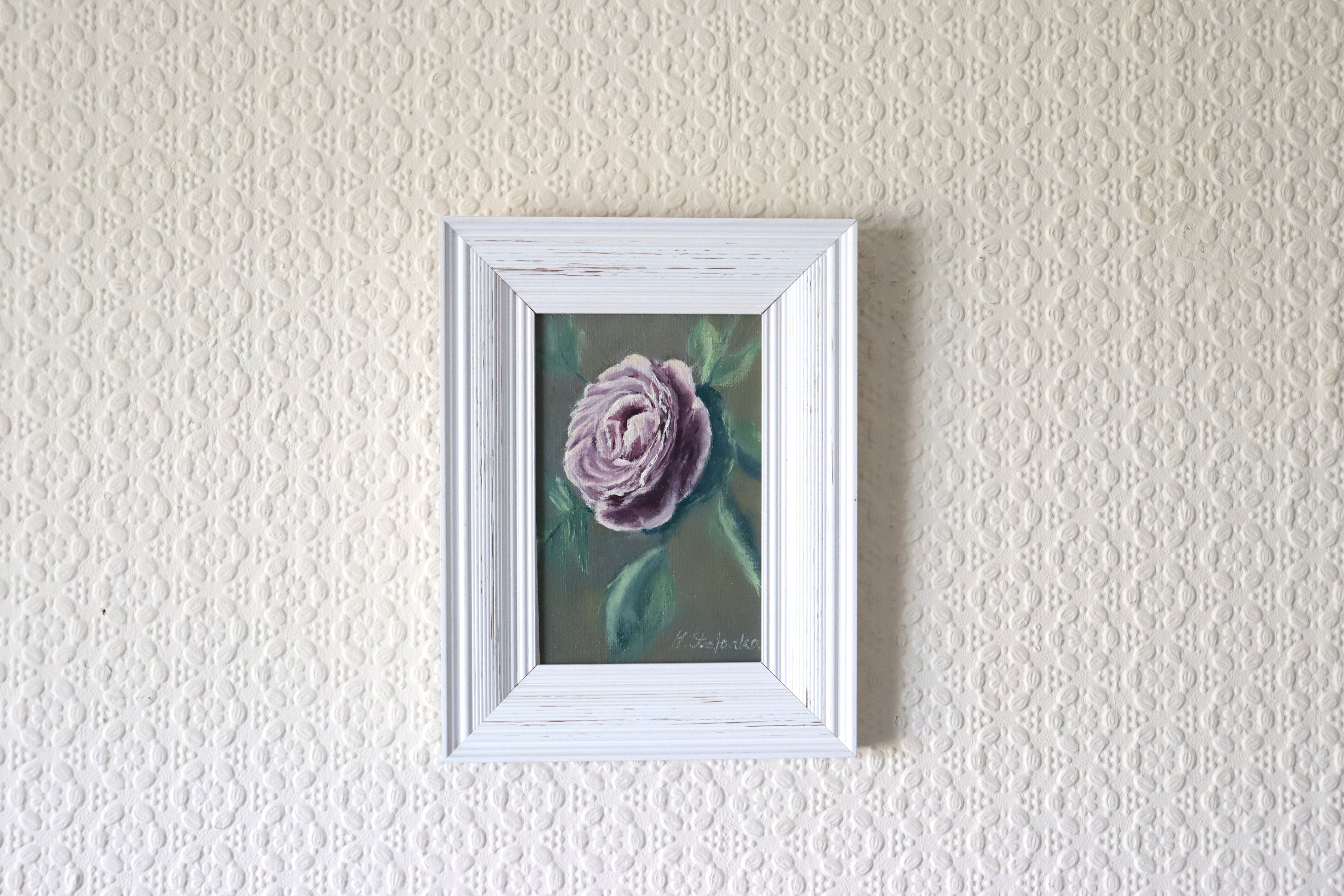 The Cottage Rose original oil painting hung on a wall - purple-mauve cottage rose in modern white wooden frame, approx. 18.5 x 23.5 cm, by Marta Stolarska Fine Art, ready to hang