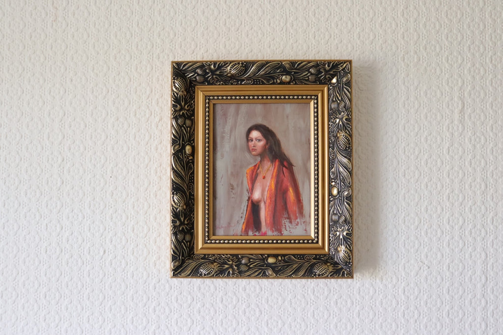The Interrupted Moment original oil painting hung on a wall - figure painting of woman in red robe, gold framed 25.5x30.5cm by Marta Stolarska, Subtle Expressions collection, ready to hang
