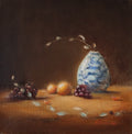The Warmth of the Autumnal Glow - original oil painting by Marta Stolarska, oranges, grapes and leaves in a white and blue vase, autumnal light glowing across the composition, 20x20cm deep edge canvas