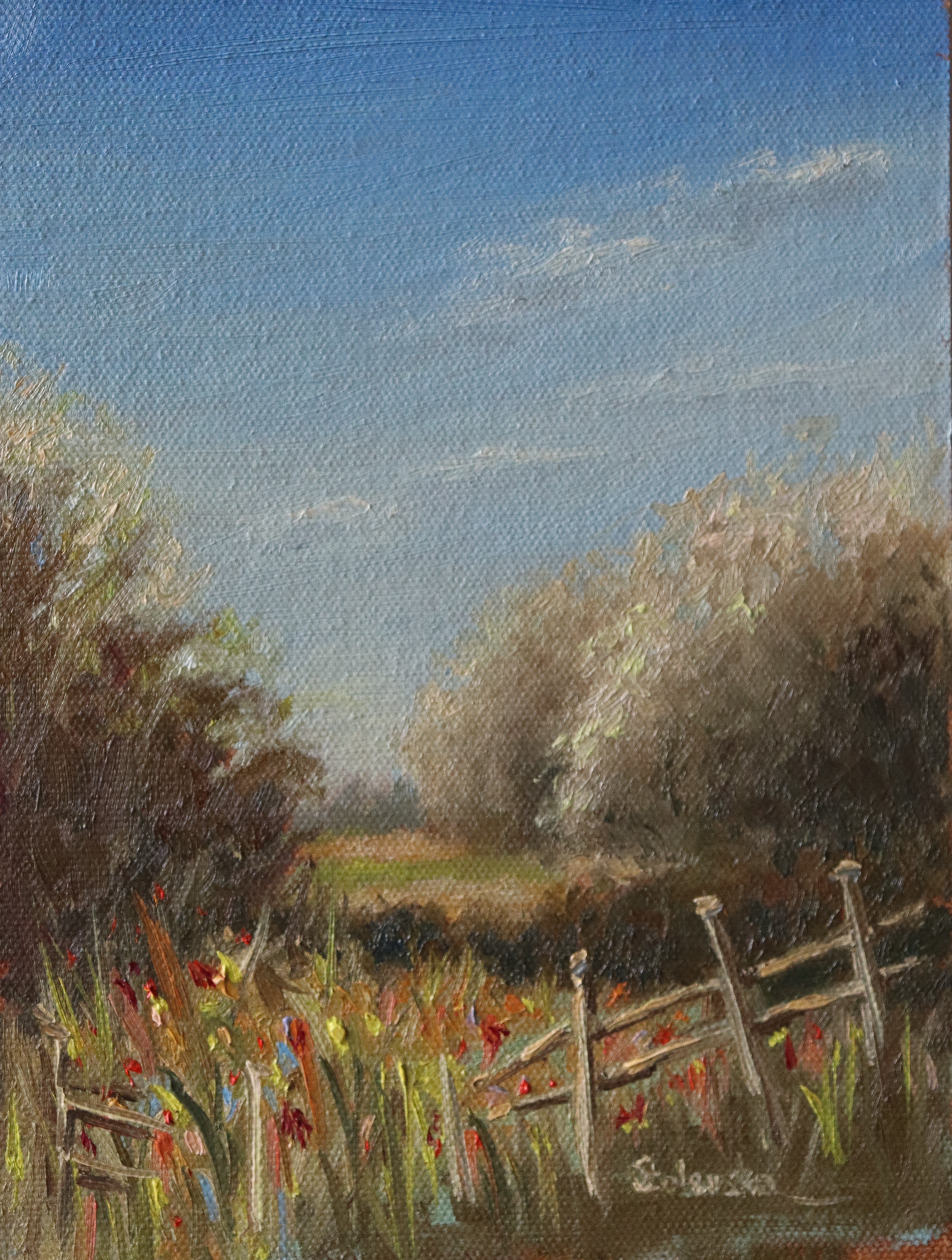 Painting of a rural landscape with a wooden fence, grass, and trees under a blue sky. Original oil painting of a path towards the meadows at Carlton Marshes Suffolk, dilapidated fence and open fields
