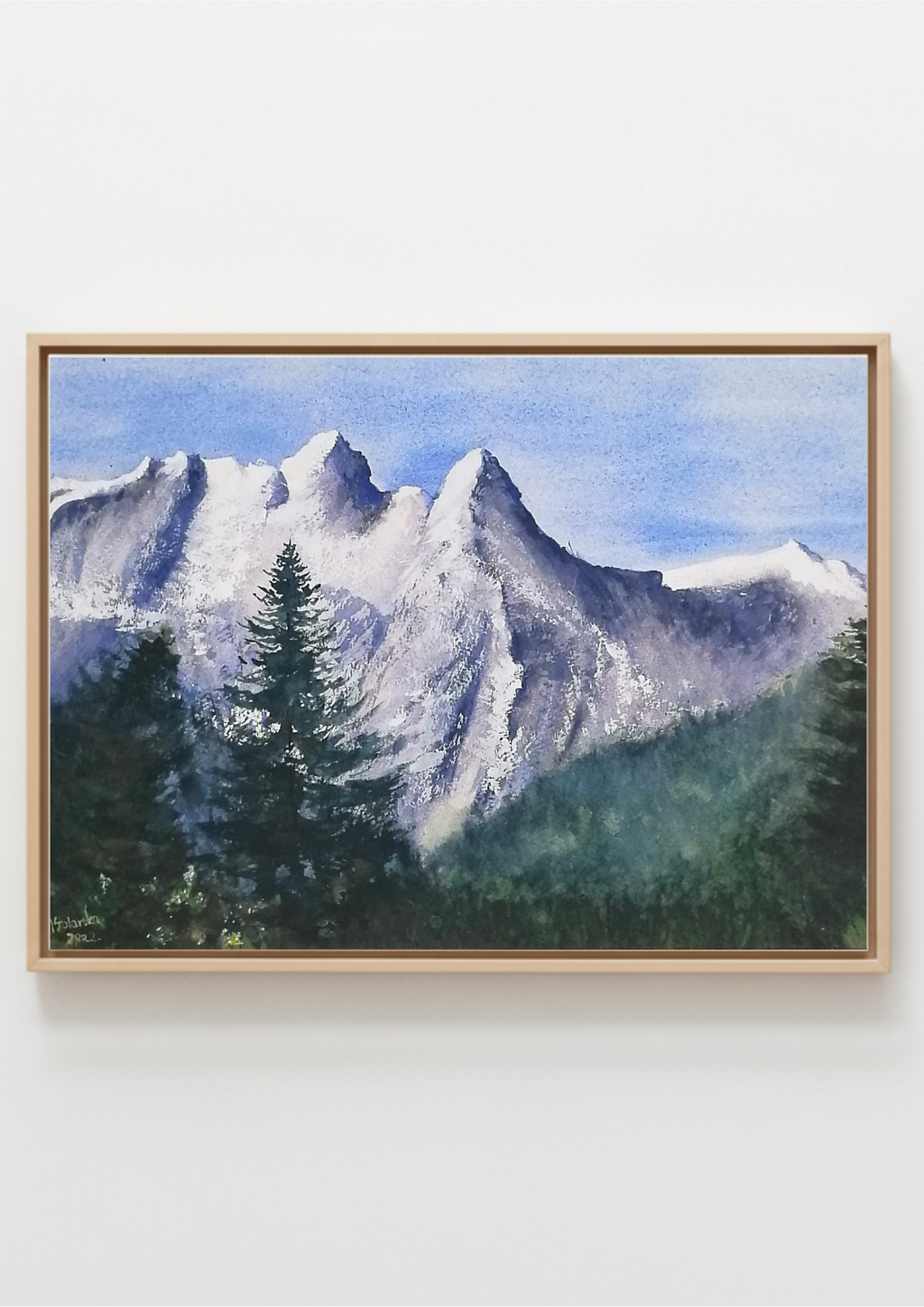 Original watercolour painting of a large snow-covered winter mountain, pale blues and whites on archival cotton paper