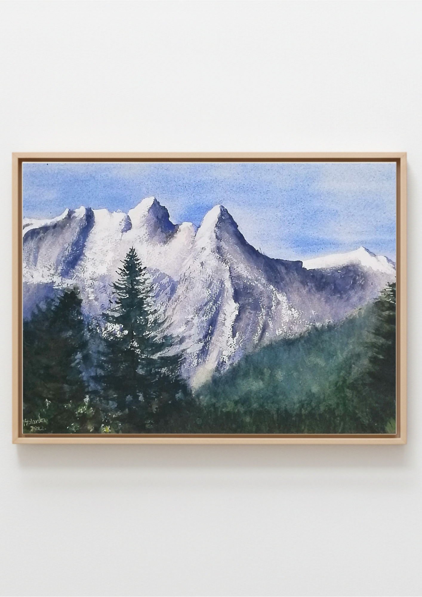 Original watercolour painting of a large snow-covered winter mountain, pale blues and whites on archival cotton paper