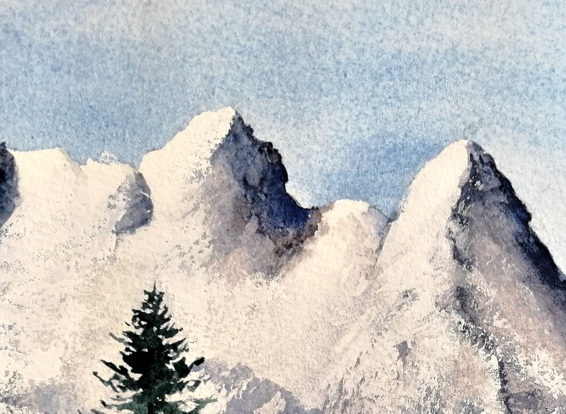 Original watercolour painting of a large snow-covered winter mountain, pale blues and whites on archival cotton paper