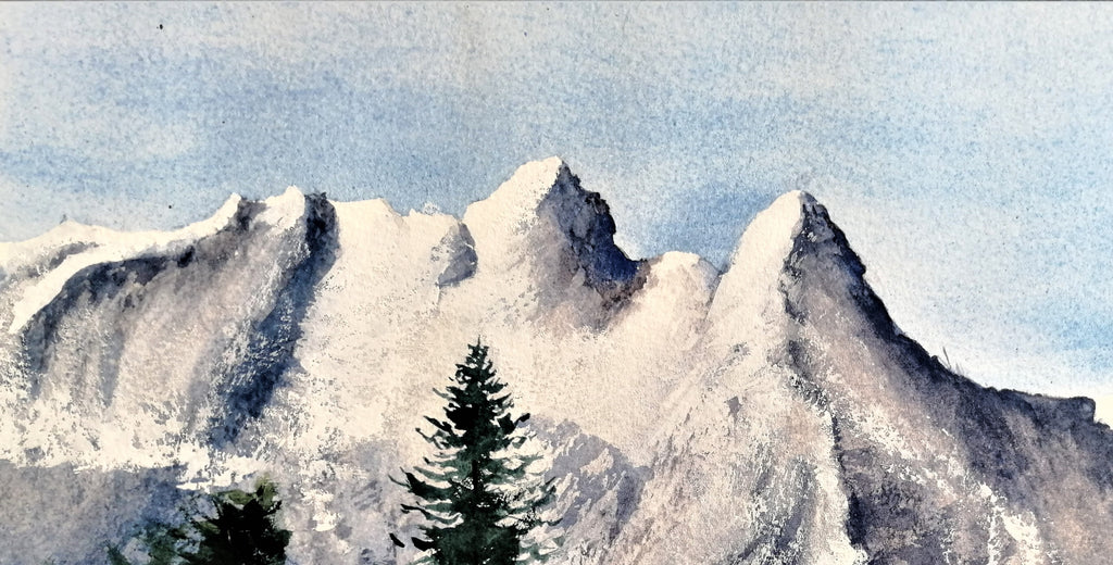 Original watercolour painting of a large snow-covered winter mountain, pale blues and whites on archival cotton paper