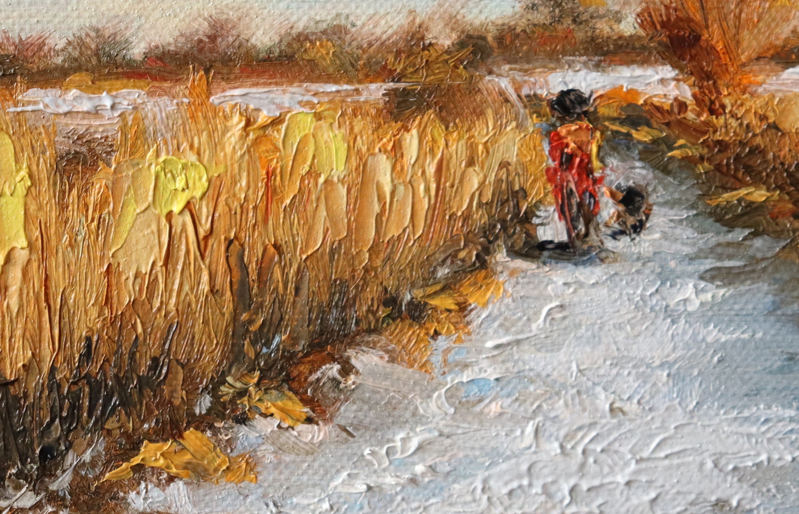 Painting of a rural scene with a person on a bike and a dog, surrounded by fields and trees by a local artist. Original oil painting of a winter walk at Suffolk marshes, snow-covered landscape with figures