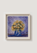 A framed art print featuring an impressionistic painting of a yellow and white flower bouquet in a blue vase against a textured purple background, set in a light wood frame on a neutral wall.