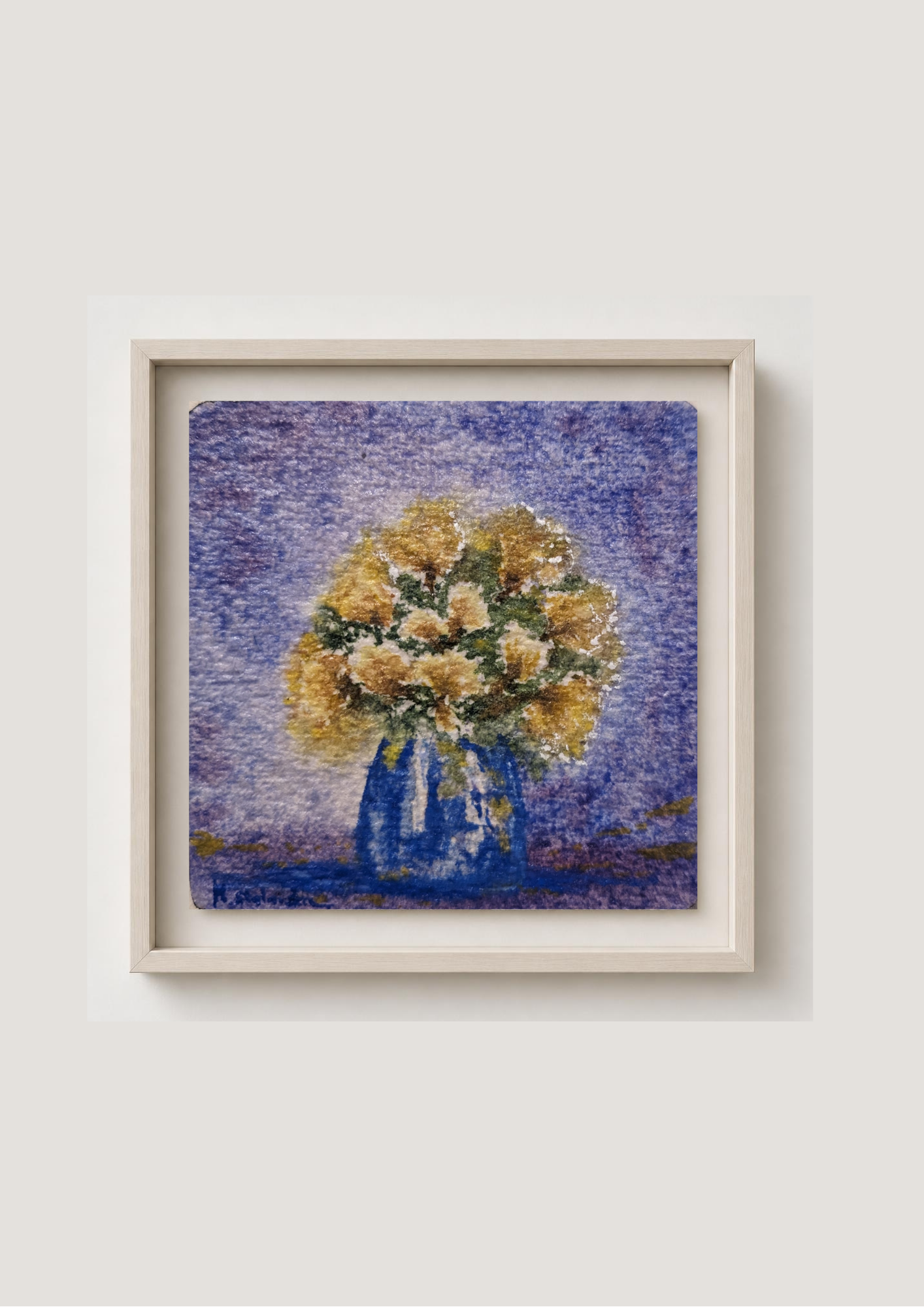 A framed art print featuring an impressionistic painting of a yellow and white flower bouquet in a blue vase against a textured purple background, set in a light wood frame on a neutral wall.